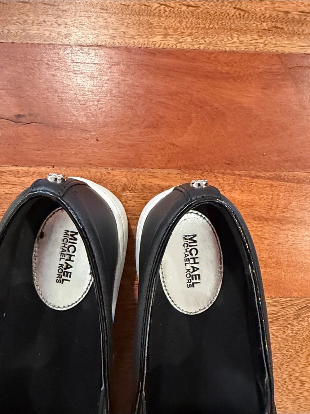 Michael Kors Black Leather Slip-On Sneakers with White Soles
